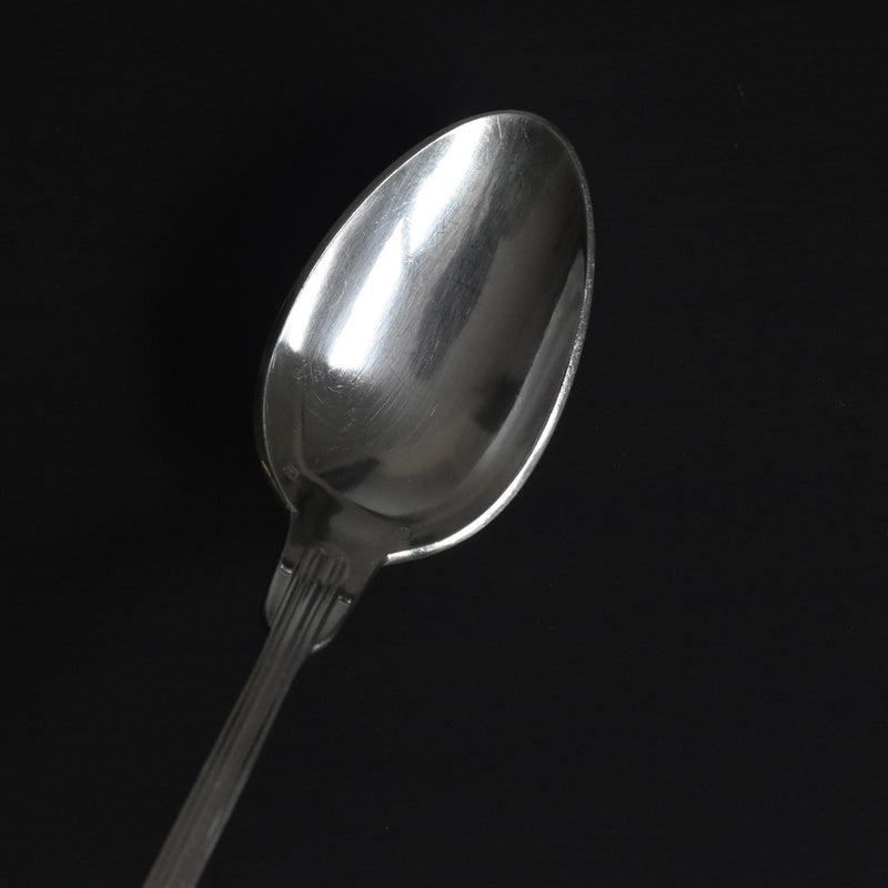 Vintage silver-plated dessert spoon with monogram