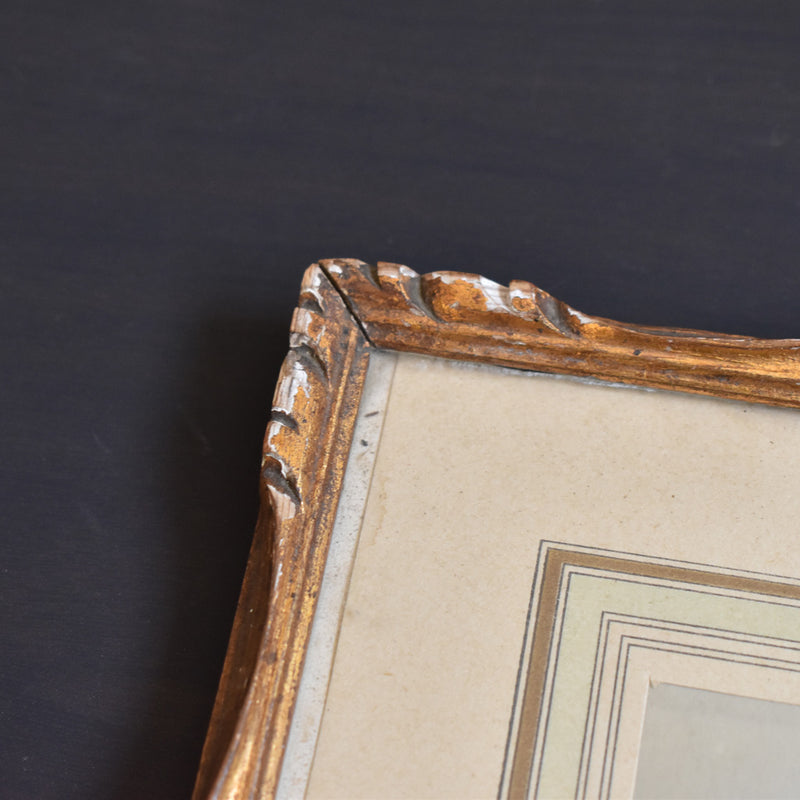 Antique frame with photo of a priest