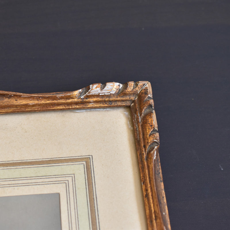 Antique frame with photo of a priest