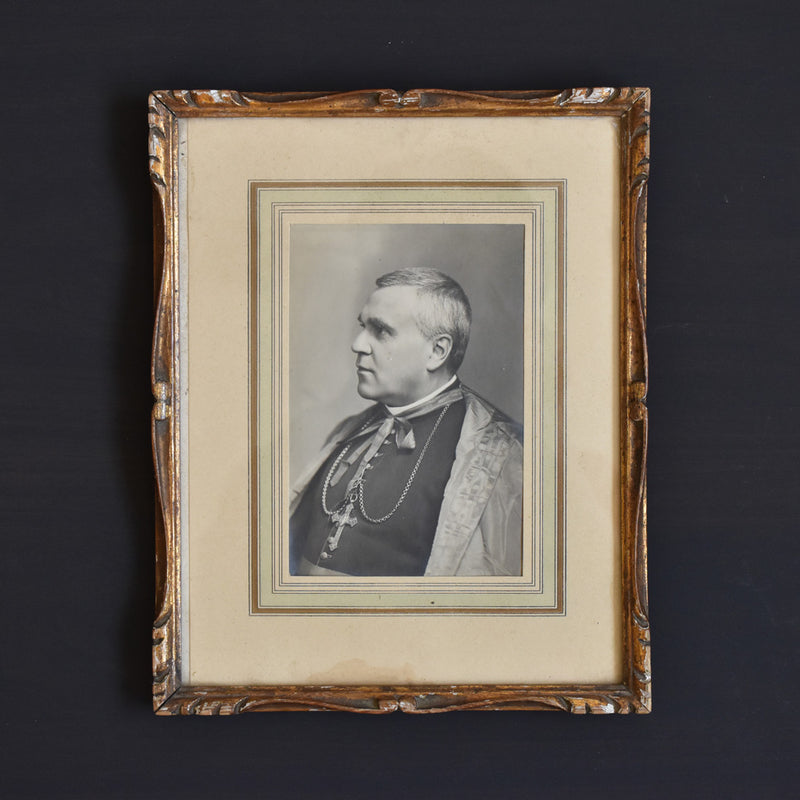 Antique frame with photo of a priest